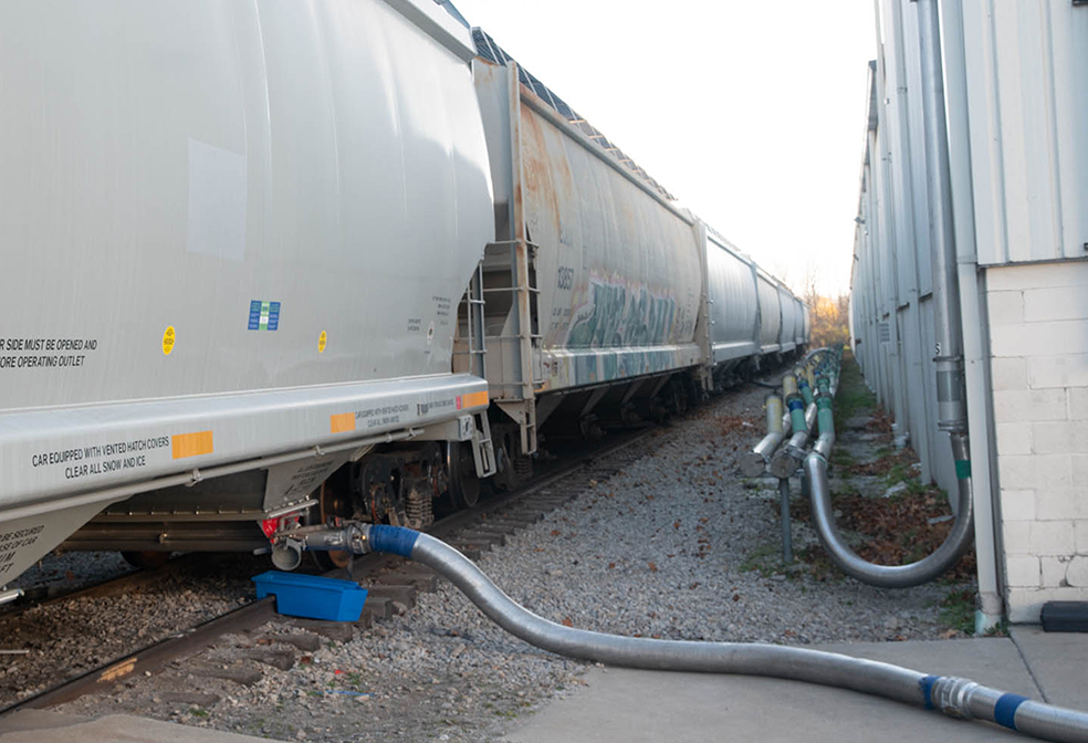 Polymer resin is being transloaded from this hopper car at ASW Global.