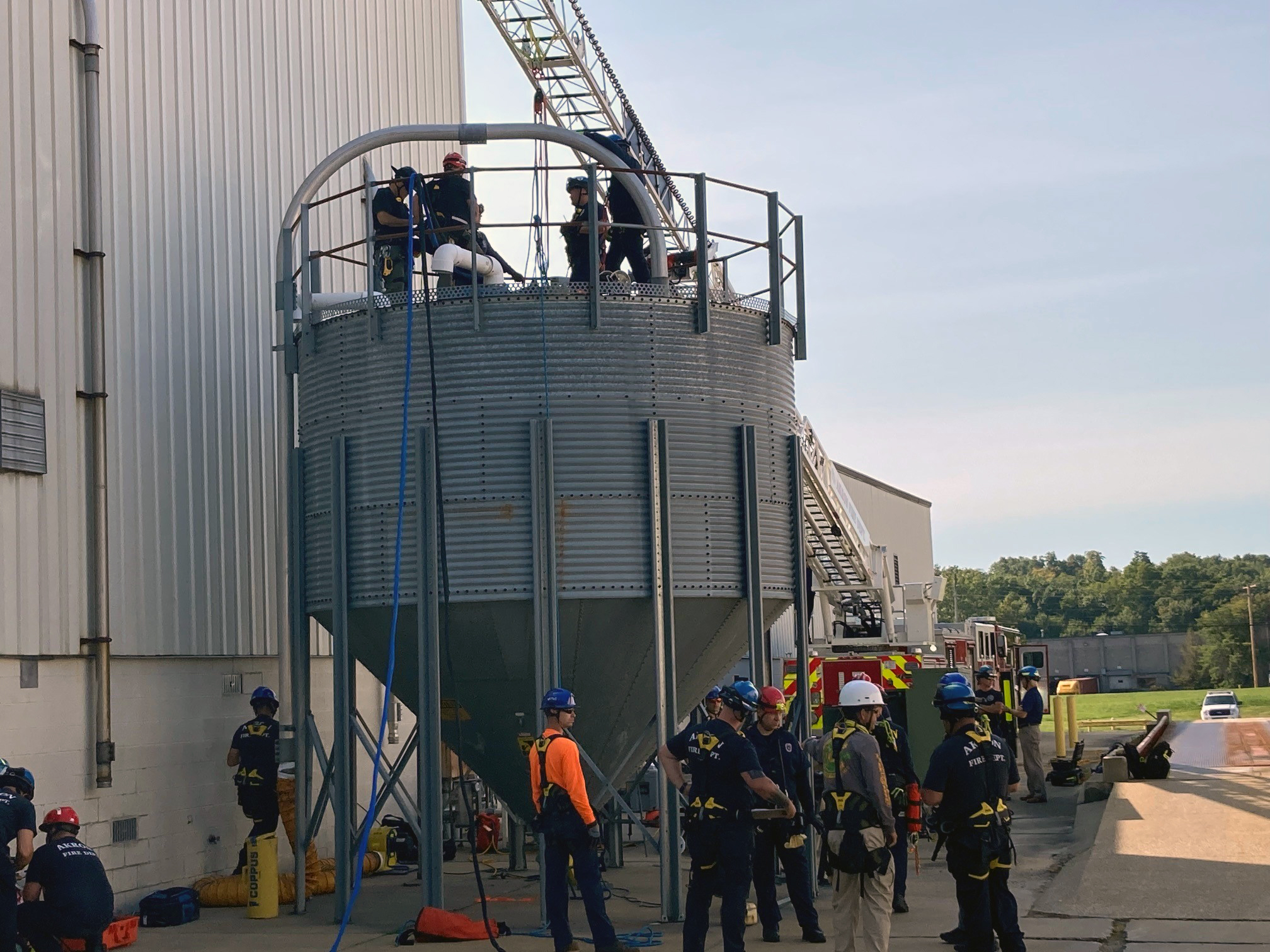 Local firefighters conduct confined spaces rescue training in a silo at ASW Global on the border of Akron and Mogadore